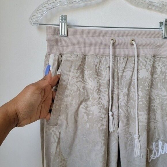 NIKE NSW Jacquard Satin Cuffed Track Pants Cream All Over Print Size XS - Picture 9 of 11